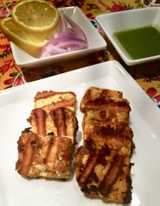 Paneer Tikka Kebab with a salad and chutney side